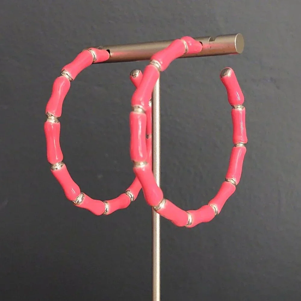 Bright glossy salmon pink enamel and silver tone hoops